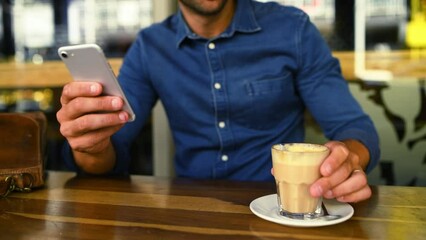 Poster - Hands, phone and coffee with a person in cafe closeup at table for social media or communication. Mobile, contact or networking and a customer in a restaurant with a caffeine beverage to relax
