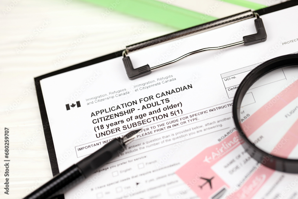 Canadian Immigration Paper Example Application for Canadian citizenship for adults on A4 tablet lies on ...