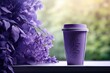  a purple coffee cup sitting on top of a window sill next to a bunch of purple lilac flowers.