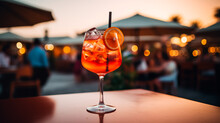 Two Glasses Of Aperol Spritz Cocktails On The Table In Restaurant At Sunset. Generative AI Illustration