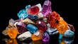 A pile of rough, uncut gemstones with various colors