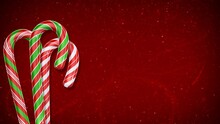 Candy Cane Dance With Snow On Red Background 4K Loop Features Candy Canes Dancing In Front Of A Bright Red Background And Swirling Animated Lines In Particles In A Loop.