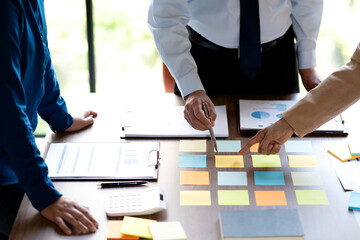 Wall Mural - The management team is standing in a brainstorming session selecting ideas