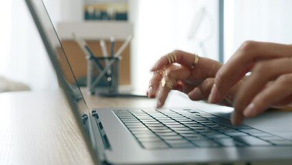 Busy female working on laptop or computer keyboard fast typing email message, surfing on web browser. Business people lifestyle 4K. Close up dolly shot of young businesswoman hands typing on keyboard