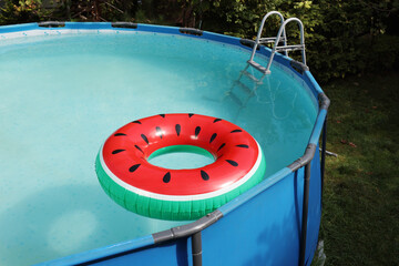 Sticker - Inflatable ring floating on water in above ground swimming pool outdoors