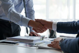 Fototapeta  - Businessman shaking hands with partner. Greeting. Business joint venture concept. For business finance, investment, teamwork and successful business.