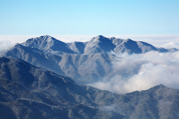 Wall Mural - a winter mountain with clouds