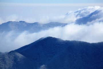 Poster - a winter mountain with clouds