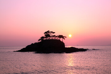 Canvas Print - an island at sunset