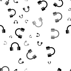 Poster - Seamless vector pattern with headphones symbols, creating a creative monochrome background with rotated elements. Illustration on transparent background
