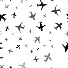 Poster - Seamless vector pattern with airplane symbols, creating a creative monochrome background with rotated elements. Vector illustration on white background