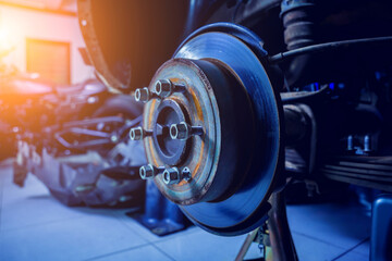 Wall Mural - Replacing spare parts on a disassembled car in a car service garage