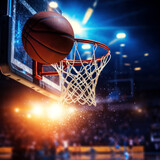 Fototapeta Sport - A basket ball flies into the basket against the background of a basketball arena, the theme of a basketball game, a competition.