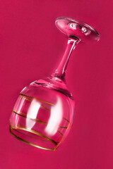 Wall Mural - Wineglass on pink background