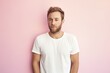 © CogniLens - Portrait of a glad man in his 30s donning a trendy cropped top against a solid pastel color wall. AI Generation
