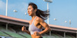 © ImageFlow - A beautiful Asian woman running at the stadium. Concept of healthcare and sport. Body training. Ai generative