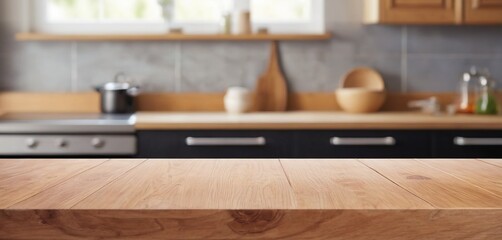 Wooden table on blurred kitchen bench background. Empty wooden table and blurred kitchen background for display or montage your products