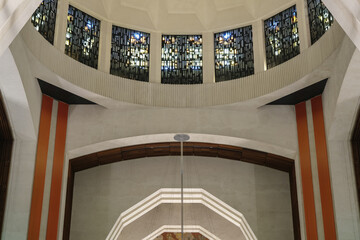 Wall Mural - Art Deco interiors of Catholic minor basilica national shrine with massive dome and arch vaults, murals, altar and columns with Renaissance Revival style facade tourist pilgrim attraction