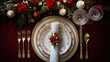  a red and white table setting with silverware, candles, flowers and candlesticks on a red tablecloth with red roses and greenery on the table.