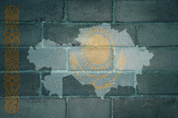 map and flag of kazakhstan on a old brick wall