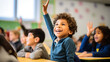 © ANC Media - Happy Mexican Boy Raising Hand in Diverse Classroom