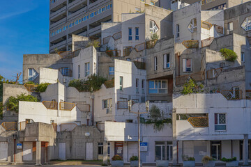 Wall Mural - Ivry-sur-Seine, France - 09 30 2021: View of the facade of a gray and white building with balconies.