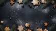 a top view flat lay christmas background border with copy space in the middle: dark grey table surface, chocolate ginger star-shaped cookies, christmas tree ornaments and branches