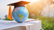 World global and mortarboard cover with incidence sunlight, education concept