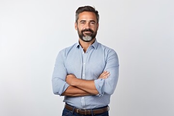 Poster - Portrait of handsome mature man with crossed arms standing against grey background