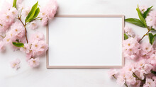 A White Frame With Pink Flowers On A White Background