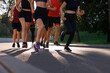 © New Africa - Group of people running outdoors on summer day, closeup