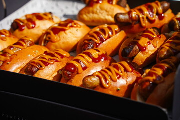 Wall Mural - Several hot dogs are laid out on the table.