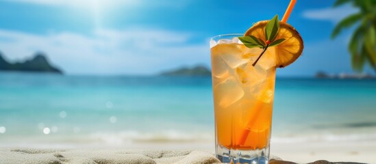 Fresh summer drink of cocktail on tropical beach background