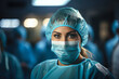 Close-up of surgeon woman looking at camera with colleagues performing in background in operation room.