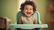 Joyful Baby Laughing in High Chair.