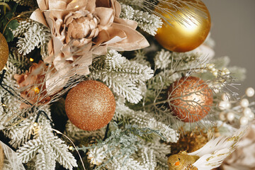 Wall Mural - Beautiful Christmas tree with golden balls decor close up