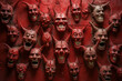 © XaMaps - Red wall featuring numerous devil and demon faces.