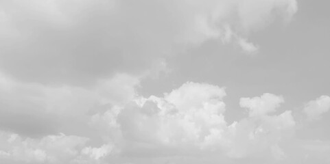 Wall Mural - White cloud in the sky. View on a soft white fluffy cloud as background.  Cloudy sky, white clouds, black background pattern. The gray cloud trendy photo. White sky image 