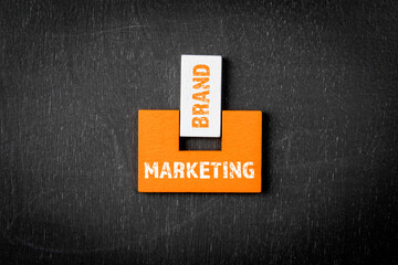 Wall Mural - MARKETING and BRAND Concept. Wooden blocks on a blackboard background