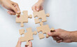 The man and woman holds in hand a jigsaw puzzle. Business solutions, success and strategy concept.