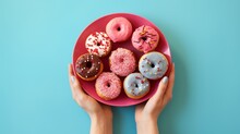 Donuts With Red, Pink And Chocolate Glaze On A Plate, 
