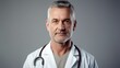 Portrait of friendly middle aged european male doctor in workwear with stethoscope 
