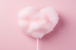 heart shaped cotton candy on a pastel pink background for valentines day
