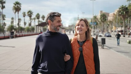 happy couple enjoying tourist trip, walking and visiting city on vacations