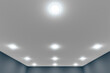 Recessed ceiling lights in a white stretch ceiling.