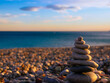 © yilmazharmanci - stack of stones on beach