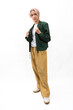 © NVB Stocker - Green informal business suit. Fashion portrait Asian young man. model, clothing and cosmetics. Young male model fashion lifestyle in fashionable clothing isolated on white background