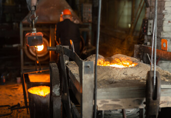 Wall Mural - Ferrous metal billet is melted in an induction furnace closeup