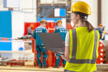 Poster - woman industrial engineer. female industrialist with laptop. girl in vest and helmet for working in 