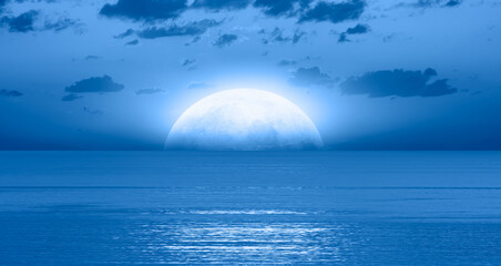 Aufkleber - Night sky with blue moon in the clouds over the calm blue sea, many sytars in the background  